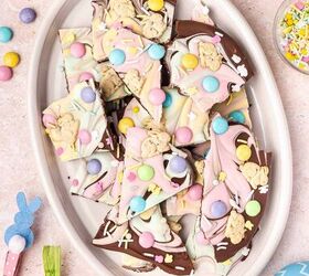 12 easy easter desserts sweet treats for kids and family, Overhead shot of a oval platter filled with irregular pieces of Pastel Easter Chocolate Bark surrounded by pastel Easter eggs and mini candies