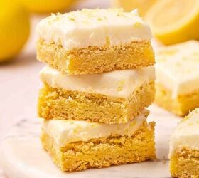12 easy easter desserts sweet treats for kids and family, Stack of three soft lemon sugar cookie bars with creamy lemon buttercream and sprinkled lemon zest