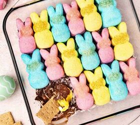 12 easy easter desserts sweet treats for kids and family, Gooey Easter Peeps s mores dip clinging to a graham cracker as it s lifted from the skillet