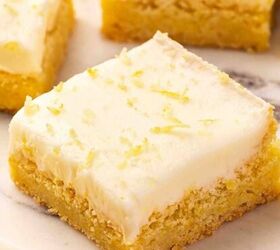 12 easy easter desserts sweet treats for kids and family, Lemon sugar cookie bars on marble slab with fresh lemon zest and scattered zest styled for spring or baby showers