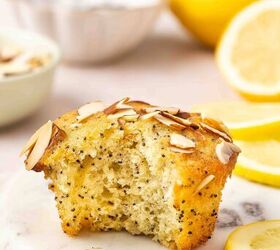 best lemon poppy seed muffins with sliced almonds, Half eaten lemon poppy seed muffin with sliced almonds showing soft fluffy interior