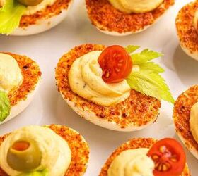 the best bloody mary deviled eggs recipe easy brunch appetizer, Close up of Taj n coated Bloody Mary deviled eggs with creamy filling and bold garnishes