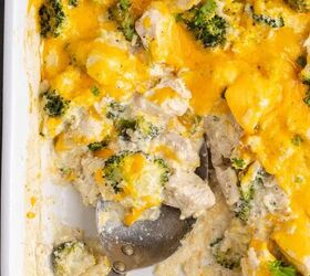 chicken broccoli and rice casserole, Chicken Broccoli Casserole with Rice from above in the baking dish with a spoon taken