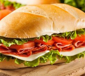 italian sub sandwich easy classic italian hoagie recipe, Two Italian Sub Sandwiches on a wooden cutting board
