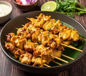 chicken satay recipe easy satay chicken, Chicken Satay Skewers on stacked on plate