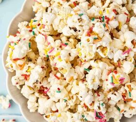 3 ingredient funfetti popcorn recipe easy no bake treat, Popcorn clusters coated with almond bark and topped with rainbow sprinkles in a serving bowl
