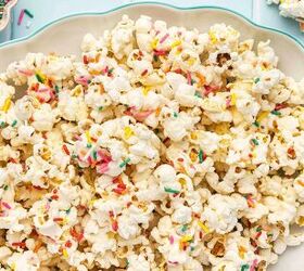 3 ingredient funfetti popcorn recipe easy no bake treat, Funfetti popcorn clusters displayed on a platter with bright rainbow sprinkles for a birthday treat