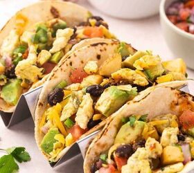 easy breakfast tacos with pico scrambled eggs, Breakfast tacos with pico de gallo scrambled eggs cheese and avocado served in a taco stand