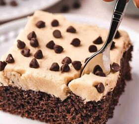 easy mexican chocolate cake recipe from cake mix, A fork slicing into a moist slice of Mexican chocolate cake with buttercream frosting on a dessert plate