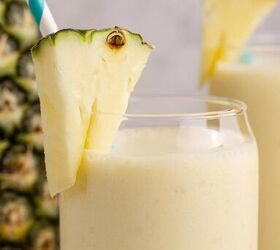 pineapple banana smoothie with coconut milk, Close up of a Pineapple Banana Smoothie with Coconut Milk with a pineapple garnish