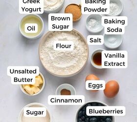 blueberry yogurt muffins with crumble topping, Various labeled bowls containing ingredients for baking blueberry yogurt muffins including flour brown sugar Greek yogurt eggs blueberries baking powder baking soda salt cinnamon vanilla extract unsalted butter oil and sugar