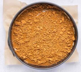 high protein no bake biscoff cheesecake, High Protein No Bake Biscoff Cheesecake topped with melted Biscoff spread and crushed cookie crumbs