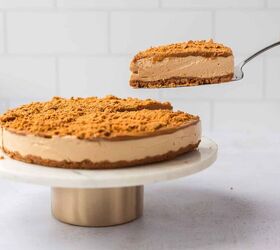 high protein no bake biscoff cheesecake, removing a slice from High Protein No Bake Biscoff Cheesecake