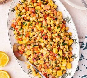 easy buffalo chickpea salad quick meal prep friendly, Buffalo chickpea salad served on a platter topped with chopped herbs and a drizzle of buffalo sauce for a fresh and vibrant look