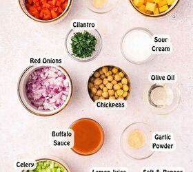 easy buffalo chickpea salad quick meal prep friendly, Assorted ingredients for buffalo chickpea salad including chickpeas celery red onion red bell pepper cheddar cheese buffalo sauce olive oil sour cream lemon and spices arranged neatly on a flat surface