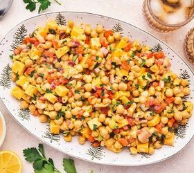 easy buffalo chickpea salad quick meal prep friendly, Top down view of buffalo chickpea salad arranged on a round platter with colorful vegetables and garnishes for a vibrant presentation