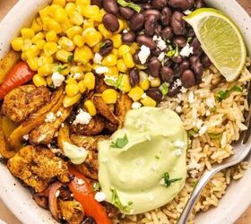 easy buffalo chickpea salad quick meal prep friendly, Chicken fajita bowl served in a bowl with rice air fried chicken and peppers black beans corn avocado lime cream cilantro and lime wedges