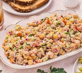 easy tuna chickpea salad sandwich recipe protein packed lunch, Tuna chickpea salad served in a large bowl style platter with chickpeas tuna and vegetables