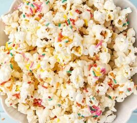 easy red white blue snack mix 4th of july no bake recipe, Colorful funfetti popcorn clusters served in a bowl with rainbow sprinkles on top