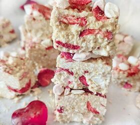 flourless chocolate chickpea cookies, A close up white chocolate strawberry quinoa bites stacked on top of each other A glass love heart infront