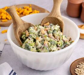 keto broccoli salad creamy crunchy and low carb, Keto broccoli salad in a bowl on a counter with cheese in the background