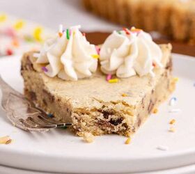 giant chocolate chip cookie cake bakery style easy to make, Chocolate chip cookie cake close up on a stack of plates with a piece taken