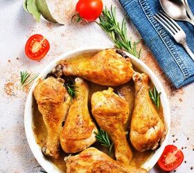 crispy baked chicken legs oven baked chicken leg recipe, Crispy Baked Chicken Legs in a white dish surrounded by rosemary and cherry tomatoes
