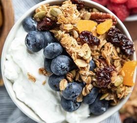 creamy coleslaw with celery seed, white bowl of yogurt with blueberries and granola on top