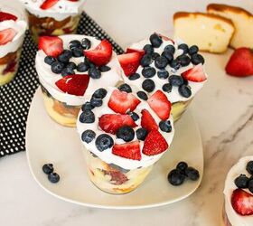 easy no bake parfait cups with fresh berries, Overhead view of berry parfait cups layered with cake vanilla pudding strawberries blueberries and whipped topping