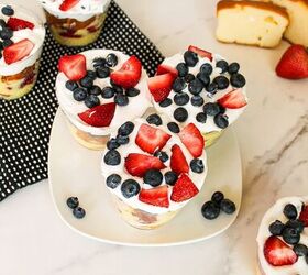 easy no bake parfait cups with fresh berries, Strawberry and blueberry parfait cups with whipped cream and pound cake served on a marble countertop