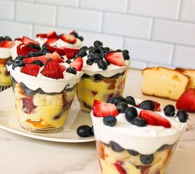 easy no bake parfait cups with fresh berries, Close up of layered berry parfait cups with vanilla pudding whipped cream strawberries and blueberries