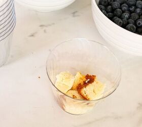 easy no bake parfait cups with fresh berries, Cubed pound cake layered into a clear plastic parfait cup to begin assembling the dessert