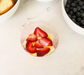 easy no bake parfait cups with fresh berries, Fresh sliced strawberries layered over vanilla pudding in a patriotic parfait cup