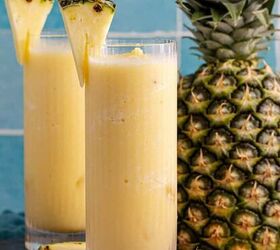 frozen non alcoholic pineapple margarita, Two glasses of non alcoholic frozen Pina coladas with a pineapple in the back