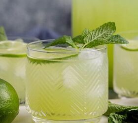 frozen non alcoholic pineapple margarita, Cucumber Agua Fresca on a cutting board with limes and mint and a pitcher in the back