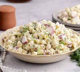 pasta salad with fresh dill, Pasta Salad with Fresh Dill in a serving bowl with a full plate in the background