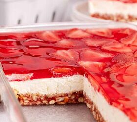 classic strawberry pretzel salad creamy crunchy, Strawberry Pretzel Salad in a baking dish with a piece taken to see the layers
