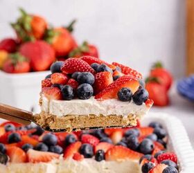 red white and blue pretzel salad made in a square pan, Red White and Blue Pretzel Salad being lift from baking dish