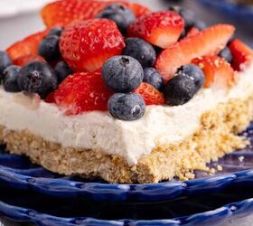 red white and blue pretzel salad made in a square pan, Red White and Blue Pretzel Salad up close with berries on top