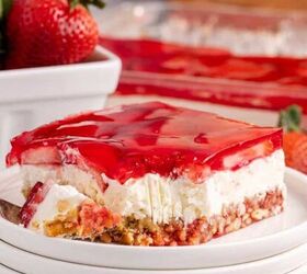 red white and blue pretzel salad made in a square pan, Strawberry Pretzel Salad on a plate with a fork beside