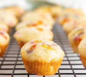 easy birthday cake mini muffins with sprinkles, Close up of a birthday cake mini muffin with colorful sprinkles cooling on a wire rack