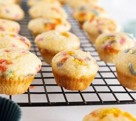 easy birthday cake mini muffins with sprinkles, Birthday cake mini muffins cooling on a wire rack with soft blurred background