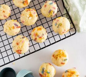 easy birthday cake mini muffins with sprinkles, Birthday cake mini muffins on a cooling rack with pastel silicone muffin liners and scattered sprinkles