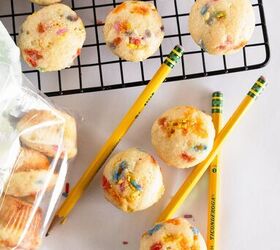 easy birthday cake mini muffins with sprinkles, Overhead view of birthday cake mini muffins with pencils rainbow sprinkles and a cooling rack