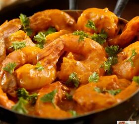 curry shrimp instant pot shrimp curry recipe, Close up image of curry shrimp in a pan with cilantro garnish