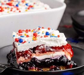 strawberry rhubarb slab pie perfect for a crowd, Red White and Blue Dessert Lasagna slice on a plate with the rest in the background