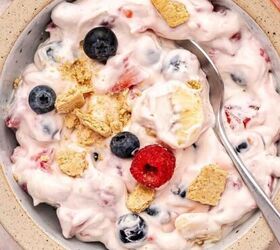 the best no bake tiramisu cheesecake cups mini dessert in jars, Creamy red white and blue cheesecake fruit salad in a serving bowl topped with crushed graham crackers and fresh berries