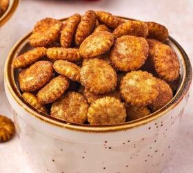 easy red white and blue funfetti cake dip recipe, Cinnamon sugar oyster crackers served in small white ceramic cups golden and crispy with a warm caramelized coating styled on a rustic wood surface with a cozy fall background