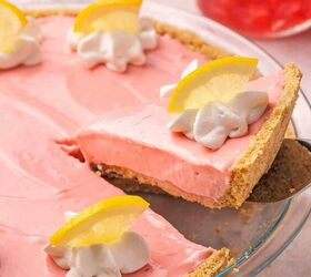 the only no bake pink lemonade pie you ll ever need, A spatula lifting a perfectly set slice of no bake pink lemonade pie from a pie dish with clean edges and a golden crust