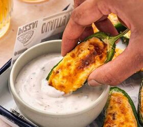 air fryer jalapeno poppers quick easy appetizer, Crispy air fryer jalape o popper being dipped into creamy ranch sauce showing melted cheese filling and crunchy golden edges